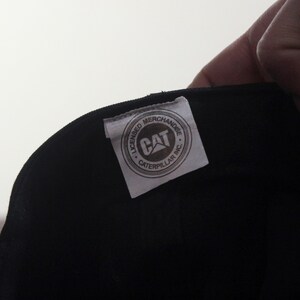 May include: A set of three ceramic mugs with a speckled, matte finish. The mugs are in shades of cream, light gray, and dark gray. Each mug has a simple, minimalist design, perfect for coffee or tea.