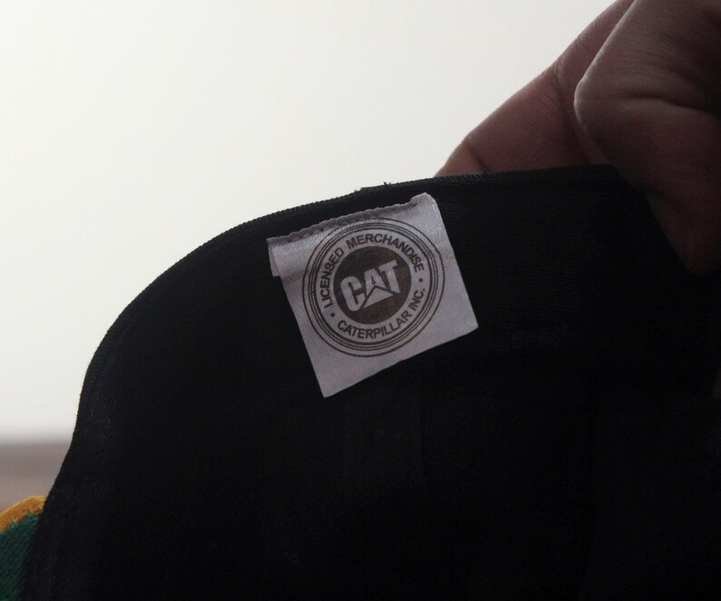 May include: A set of three ceramic mugs with a speckled, matte finish. The mugs are in shades of cream, light gray, and dark gray. Each mug has a simple, minimalist design, perfect for coffee or tea.