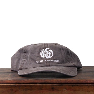 May include: A handmade wooden chopping board with a natural grain. It has a juice groove and a handle. Dimensions are approx. 40.6 cm long, 25.4 cm wide, and 1.9 cm thick.