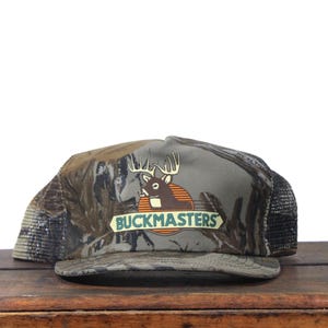Vintage Camo Snapback Trucker Hat Baseball Cap Buckmasters Deer Hunting Fishing Store Outfitters Buck Woodland Camouflage Made In USA