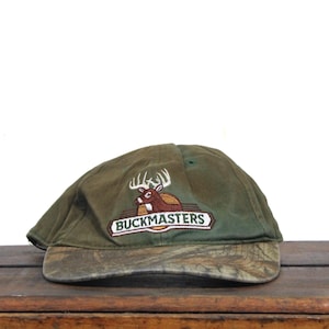 Vintage Distressed Beater 90s Snapback Hat Baseball Cap Buckmasters Deer Hunting Fishing Store Outfitters Buck Camo Camouflage Brim