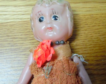 Really old, Carnival prize plastic doll. I would guess that she is from the 1930-40s, but she is not dated