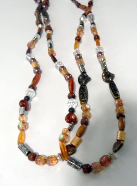Long necklace and plastic beads and silver spacers