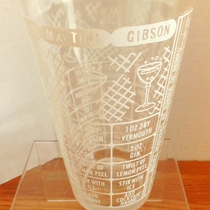 Vintage glass cocktail shaker,  Bar ware, glasses, with drink menus.       6“ tall