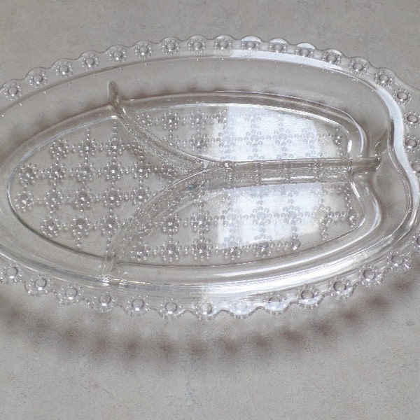 Nice, elegant pressed glass tidbit server.  It has a daisy flower edging, and daisy button design, elegant glass, dining, serving, dishes