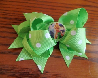 Boutique style puffy hair bow, Tinkerbell bottle cap accent, This is a 5” bow.  Tinkerbell, Princess bow, spring green polka dot bow