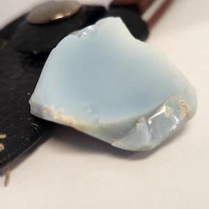 May include: A set of three ceramic mugs with a speckled, matte finish. The mugs are in shades of cream, light gray, and dark gray. Each mug has a simple, minimalist design, perfect for coffee or tea.