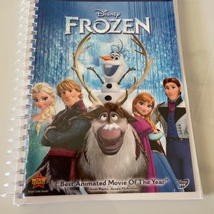 May include: A DVD case for the Disney film Frozen. The cover features the main characters, including Elsa, Anna, Kristoff, Olaf, and Sven. The text on the cover reads "Disney Frozen" and "Best Animated Movie Of The Year".