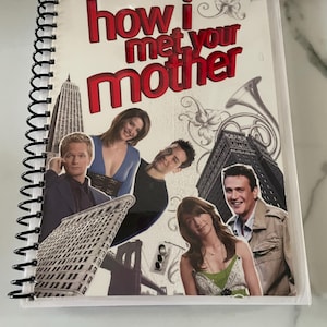 May include: A spiral bound notebook with a collage of images from the TV show "How I Met Your Mother" on the cover. The cover features the show's title in red letters, a cityscape, and several characters from the show.