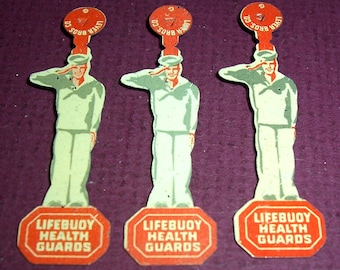 Three 1930s Lifebuoy Soap Health Guards tin badges