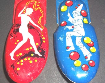 2 large vintage tin clickers