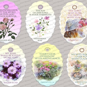 May include: Six oval-shaped, pastel-colored gift tags with floral designs and inspirational Bible verses. The tags feature a variety of flowers, including roses, hydrangeas, and daisies. The verses are printed in black text and include Isaiah 40:8, Nehemiah 8:10, Psalm 29:11, Isaiah 61:10, Psalm 65:11, and Zephaniah 3:17.