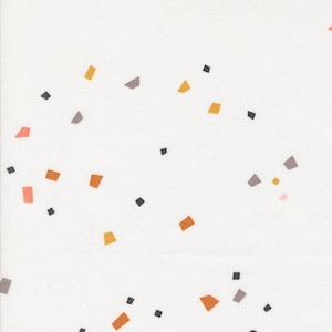May include: White fabric with a scattered pattern of small, irregular shapes in various colors. The shapes include orange, gray, yellow, pink, and black, creating a playful and modern design. The fabric has a subtle texture.