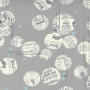 May include: A grey fabric with a repeating pattern of white circles filled with black and white newspaper text. The circles are scattered randomly across the fabric. There are also small blue circles scattered across the fabric.