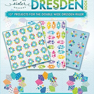 May include: A book cover with a blue and white quilt pattern featuring a Dresden design. The title of the book is "Double Wide Dresden Book" and the subtitle is "13+ Projects for the Double Wide Dresden Ruler". The book is by Barbara Groves and Mary Jacobson. The text "The fast, fun & easy way to make a modern Dresden with no raw edges" is at the bottom of the cover.