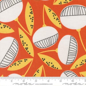May include: Orange fabric with a repeating pattern of white and black stylized flower-like shapes, and yellow leaf shapes with black dots. The fabric has a ruler along the bottom with the word "moda" printed on it.