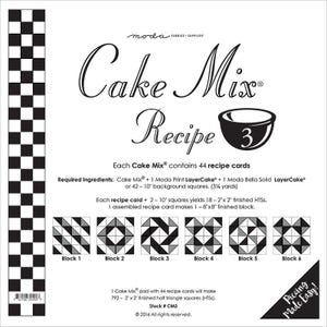 May include: Black and white checkered fabric pattern with a Moda Cake Mix Recipe 3 instruction sheet. The sheet includes instructions for making a quilt block using 44 recipe cards. The sheet also includes a list of required ingredients, including a Moda Print Layer Cake, a Moda Bella Solid Layer Cake, and 42-10 inch background squares. The sheet also includes a diagram of the six quilt blocks that can be made using the recipe cards.