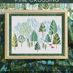 May include: A cross stitch pattern depicting a winter woodland scene with pine trees, snow, and red birds. The pattern is titled "Pine Crossing" and is by Robin Pickens Cross Stitch Patterns.