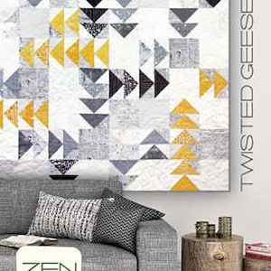 May include: A quilt pattern featuring a geometric design of black, white, and yellow triangles. The pattern is called "Twisted Geese" and is by Zen Chic, Brigitte Heitland.