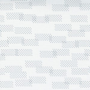 May include: White fabric with a repeating pattern of small, dark gray dots arranged in diagonal lines and rectangles.