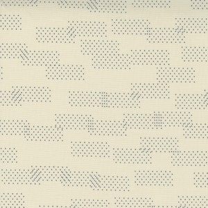 May include: Abstract pattern of small black dots arranged in a geometric pattern on a cream background.