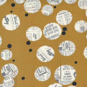May include: A mustard yellow fabric with a repeating pattern of white circles filled with black and white newspaper text. The circles are of varying sizes and are connected by thin brown lines.