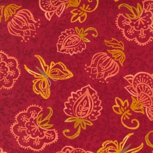 May include: Red fabric with a repeating pattern of orange and yellow stylized flowers and butterflies.