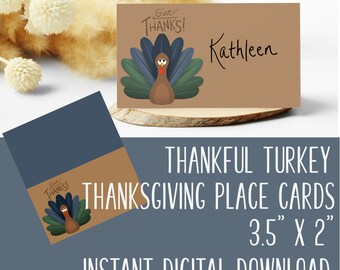 May include: Printable Thanksgiving place cards featuring a cartoon turkey with the text "Give Thanks!" and a brown background. The cards are 3.5 inches by 2 inches.