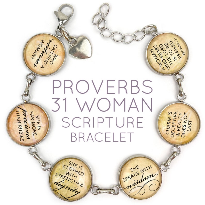 May include: A silver bracelet with charms featuring quotes from Proverbs 31. The charms are round and have a vintage look with a beige background and black text. The bracelet has a heart-shaped charm and a lobster clasp.
