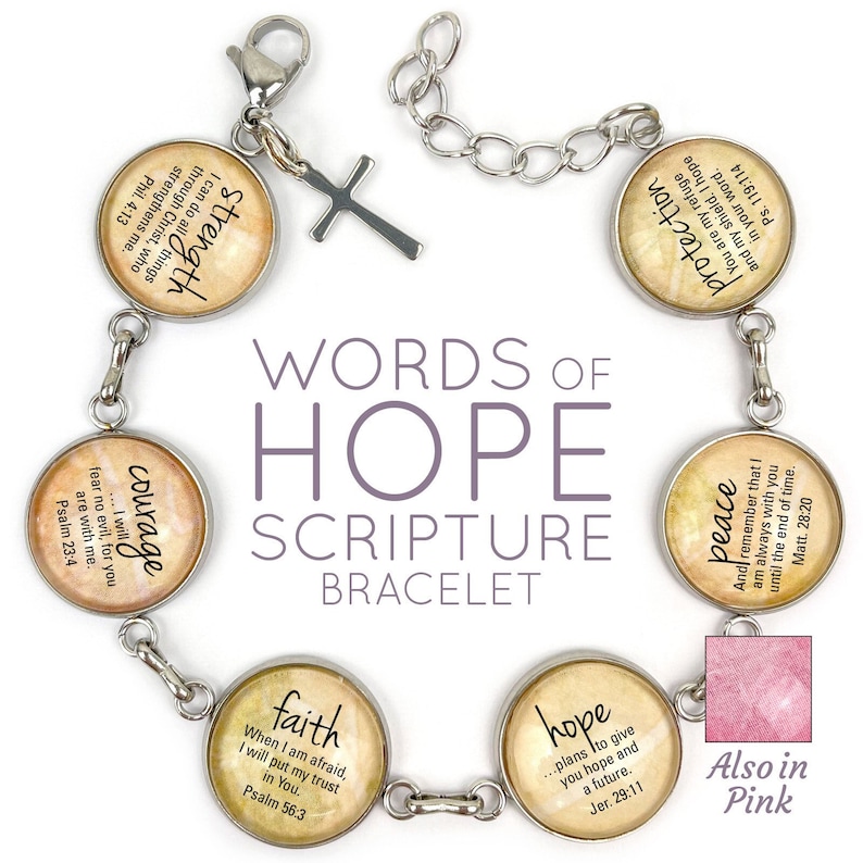 May include: A silver bracelet with seven charms, each featuring a different word of hope and a scripture verse. The charms are: Strength, Courage, Faith, Hope, Peace, Protection, and a cross. The bracelet is also available in pink.
