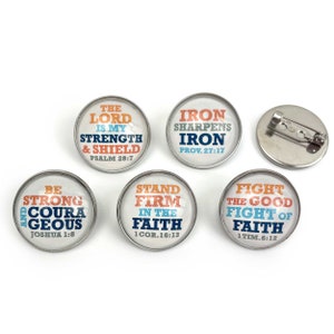 May include: Five round pins with white backgrounds and colorful text. The pins feature inspirational quotes and bible verses. The pins are perfect for adding a touch of faith to your style.