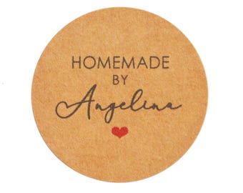 May include: Round brown paper sticker with the text "HOMEMADE BY Angelina" in black lettering and a small red heart.
