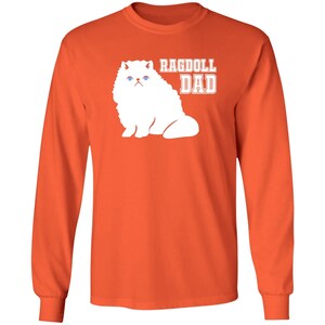 May include: Orange long-sleeve t-shirt with a white silhouette of a Ragdoll cat and the text "Ragdoll Dad".
