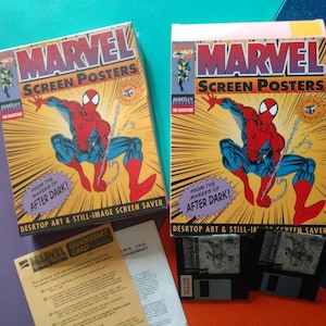 May include: Two boxed copies of a Marvel Screen Posters computer game for Macintosh. The boxes feature a comic book style illustration of Spider-Man in red and blue, swinging from a web. The text on the boxes reads "Marvel Screen Posters" and "From the makers of After Dark!"