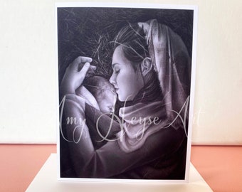 May include: Black and white art print of a mother cradling a baby. The artwork is a pencil drawing style, with the mother's face close to the baby's. The print is on a white card, with the artist's signature in the bottom left corner.