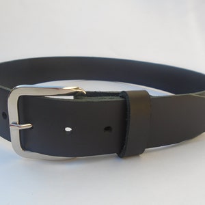 May include: A black leather belt with a silver buckle.