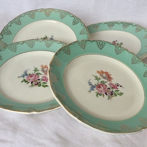 4 small plates in flowered and golden porcelain , St Amand