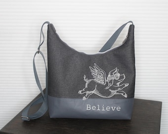 Shoulder bag embroidered with winged pig, Believe