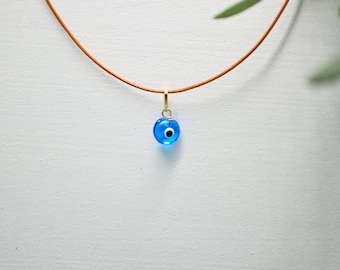 9K Gold Greek Evil Eye Pendant. 9K Solid Yellow Gold Bail. Ocean Blue Murano Greek Eye. Leather Camel Cord. Good Luck and Protection Charm