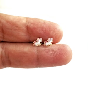 9K Tiny Gold White Unicorn Stud Earrings. 9K Solid Yellow Gold. White & Pink Enamel. 9K Gold Butterfly Clasp