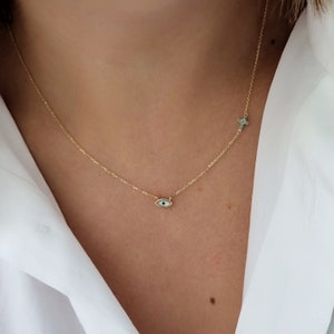 Colgante de collar con cruz y mal de ojo griego de 14 Κ. Oro macizo amarillo de 14 quilates. Cruz de circonio cúbico. Joyas de buena suerte y protección.