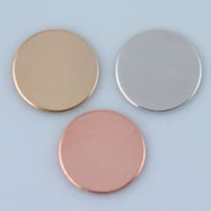 May include: Three round metal discs in gold, silver, and copper.