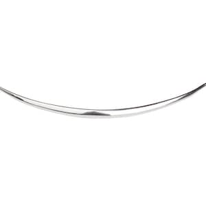 May include: A silver, curved, metal bangle bracelet.