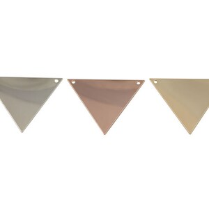 May include: Three triangle-shaped metal charms in silver, rose gold, and gold. Each charm has two holes at the top for attaching to jewellery.