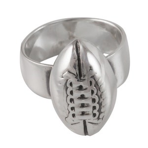 May include: A silver ring with a football design. The football is detailed with laces and a textured surface.