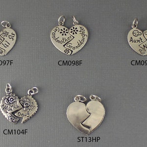 May include: Five silver heart-shaped charms with different inscriptions. The charms are split in half, with each half having a different inscription. The inscriptions are: "Big Sis", "Lil Sis", "Grandmother", "Granddaughter", "Aunt", "Niece", "Mother", "Daughter".