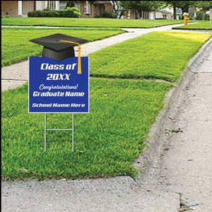 May include: Blue graduation yard sign with a black graduation cap on top. The sign says "Class of 20XX Congratulations! Graduate Name School Name Here"