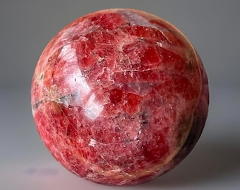 Vibrant old-stock Gel Rhodonite sphere with black manganese, quartz veining & Chatoyant flash — high-grade collector piece (299)