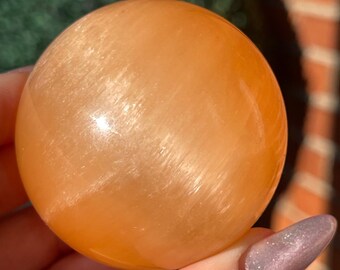 Peach Selenite Sphere with a beautiful flash