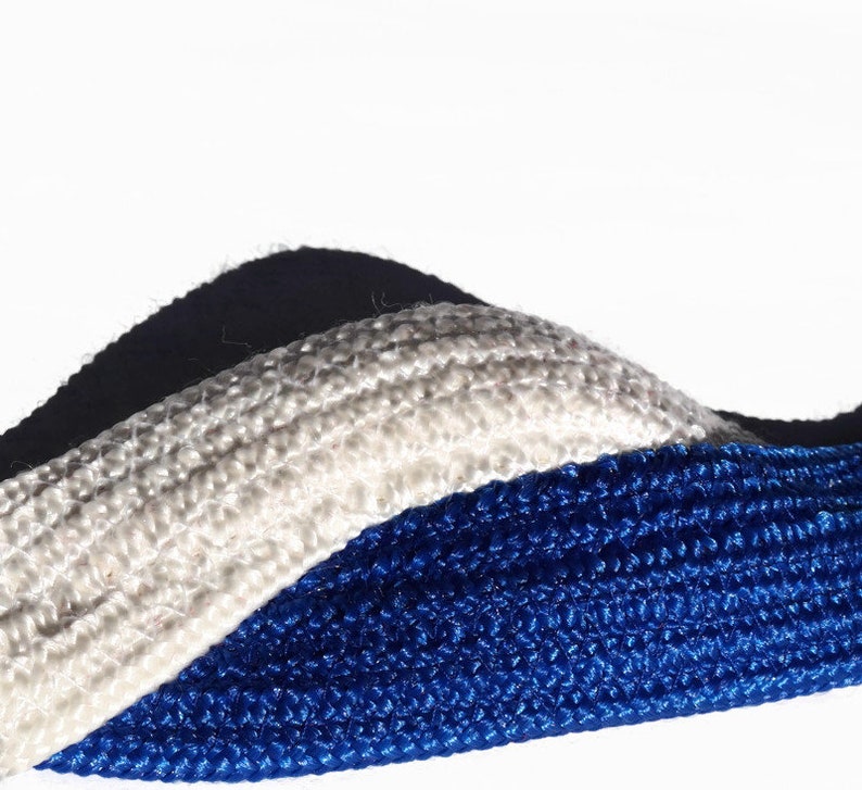 May include: Close-up of three textured ropes in white, blue, and navy. The ropes are arranged in a wavy pattern against a white background. The blue rope is in the foreground, with the white rope in the middle and the navy rope in the background.